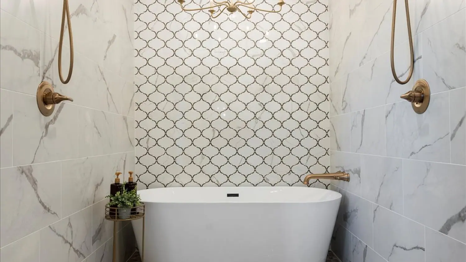 Custom walk-in shower and freestanding tub with brass fixtures