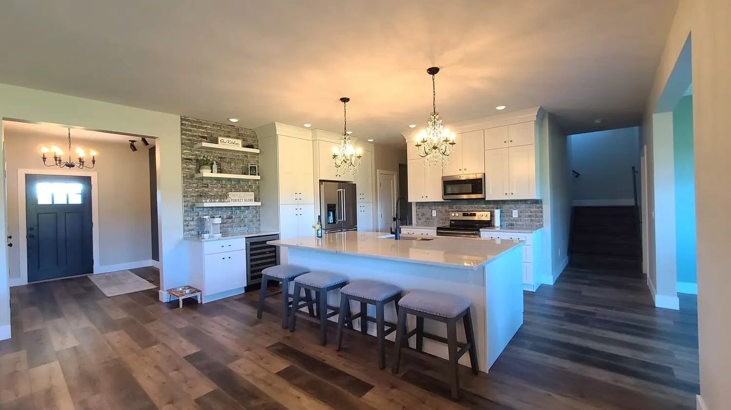 Open kitchen with a long island and seating for five